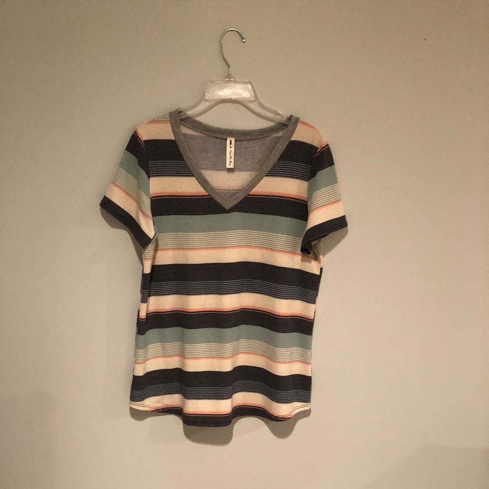 striped T-shirt and blues and greens. The brand is vanilla bay, size medium.
